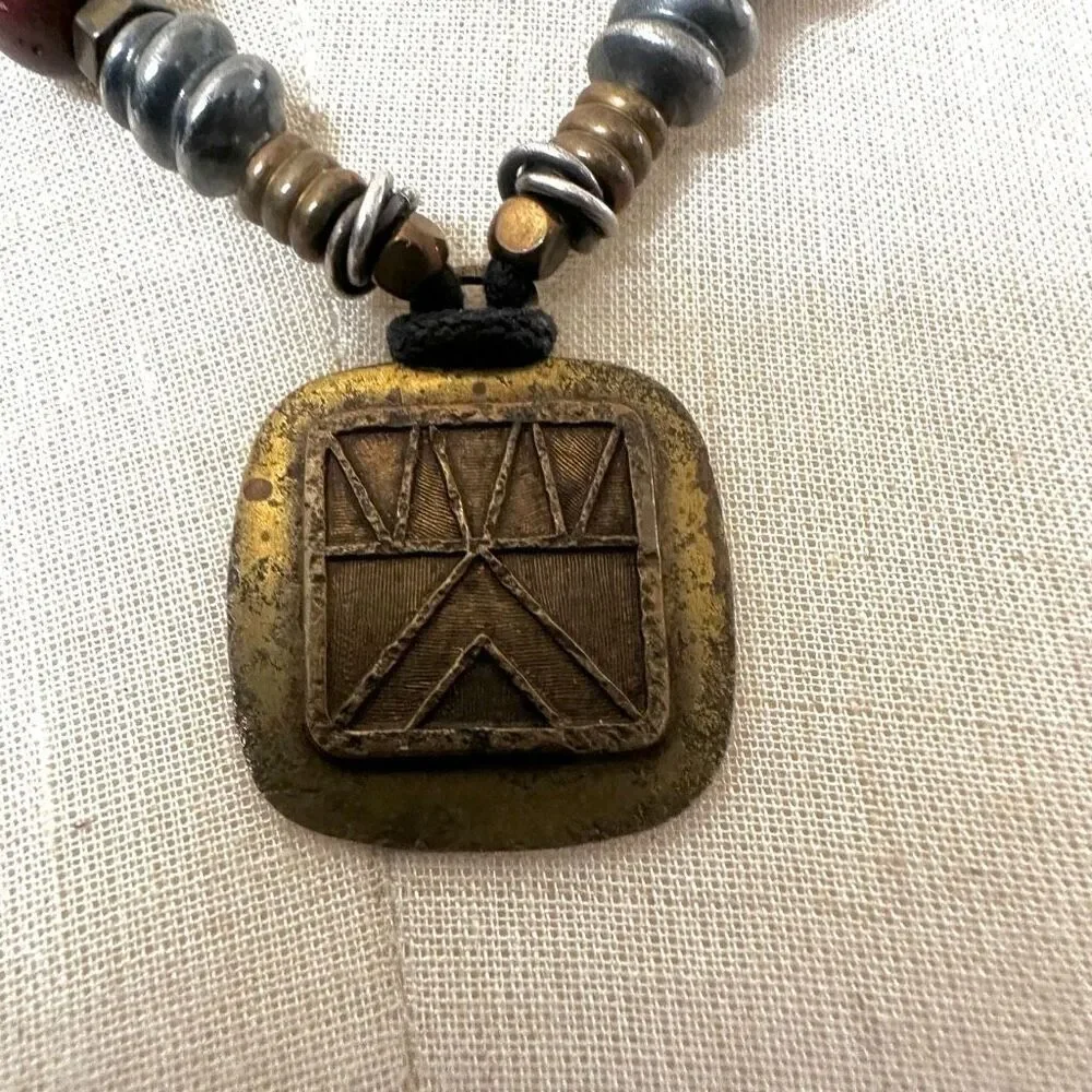 Baer SF sterling silver and brass pendant necklace on black cord